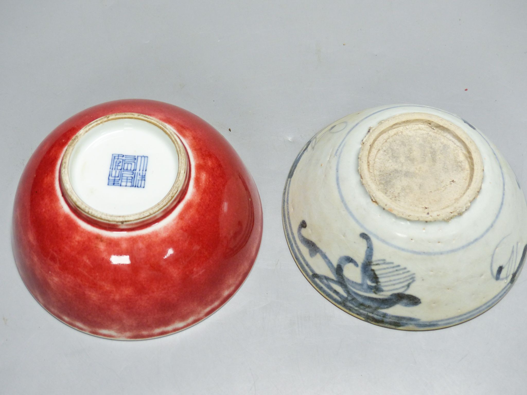 A Chinese sang de boeuf bowl and a blue and white bowl, 12.7cm